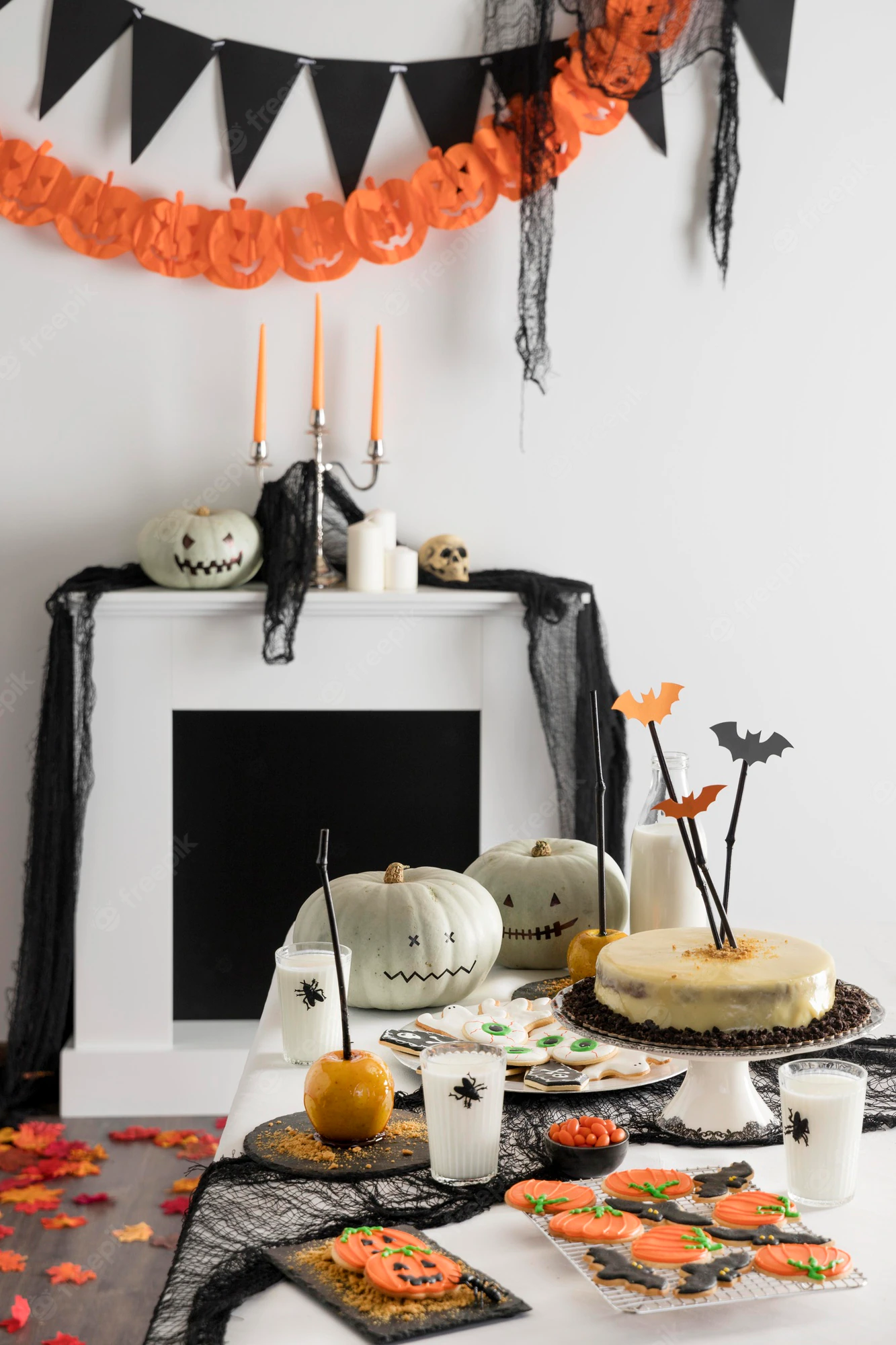 table-with-halloween-party-treats-decorations_23-2148603693