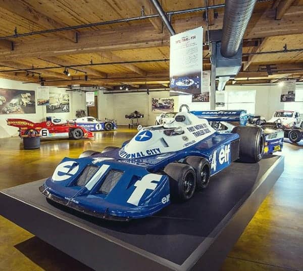 spacious-wood-ceiling-dream-garage-with-race-vehicles