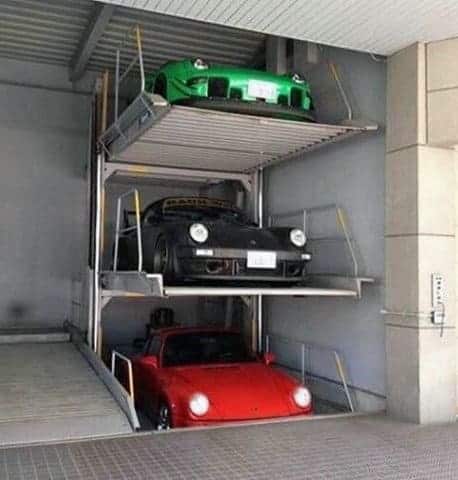 three-story-lift-mens-porsche-dream-garage