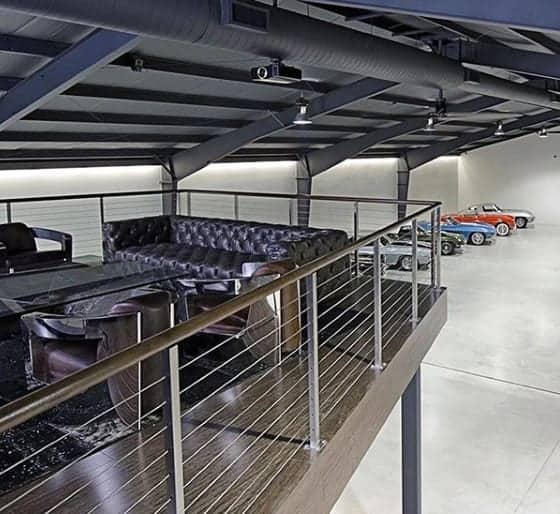 two-story-lounge-mens-dream-garage-with-classic-cars